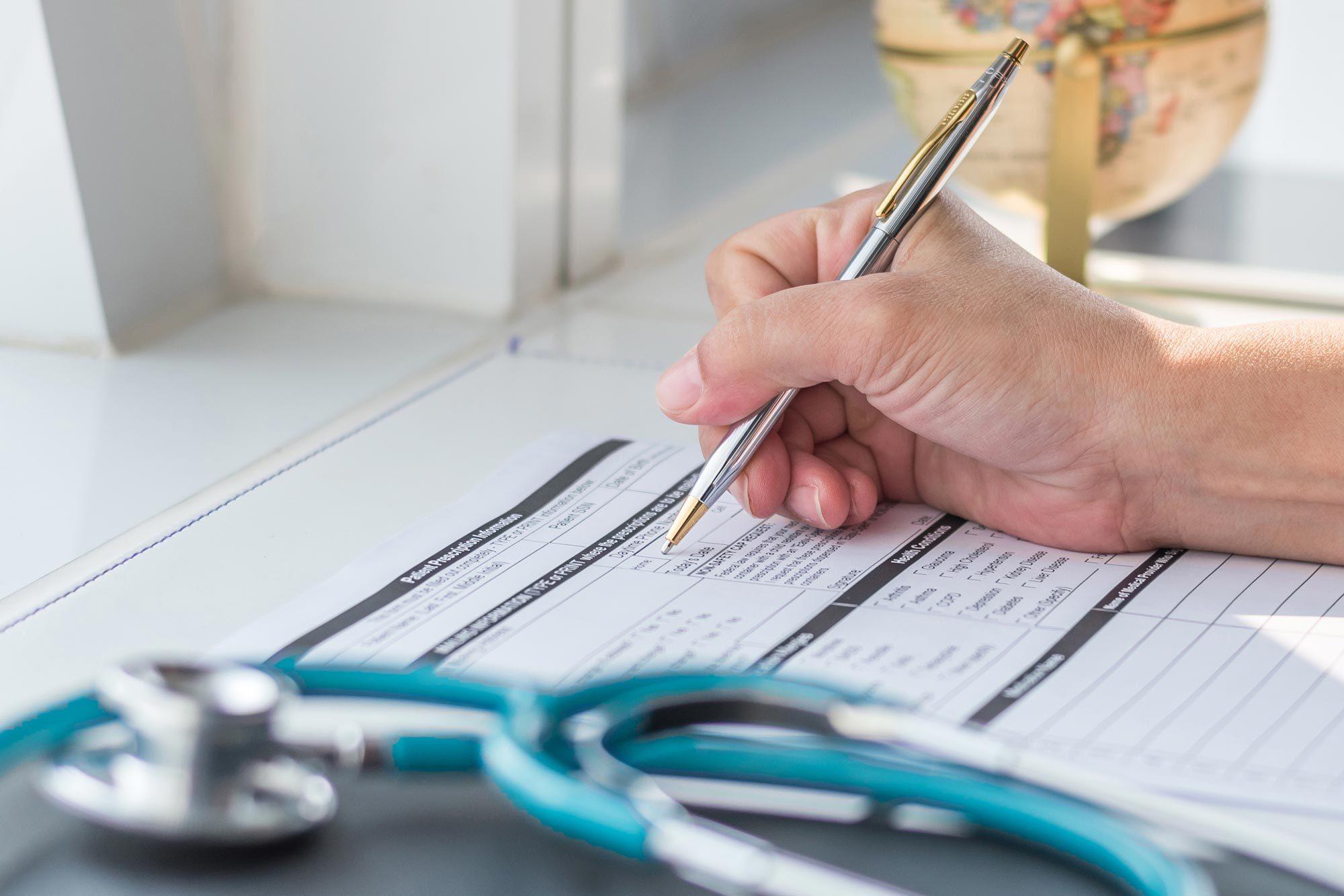 a person filling out a healthcare proxy document