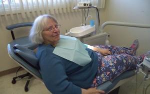 An elderly woman at the dentist