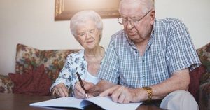 An elderly couple doing research on an elder care attorney