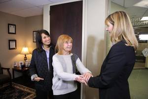 Jennifer Cona greeting people at her elder law attorney open house