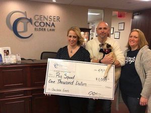 Cona Elder Law raises $1000 for NY Based Pug Rescue group