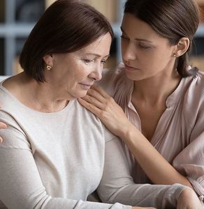 A daughter and mother discussing the mother's estate plans