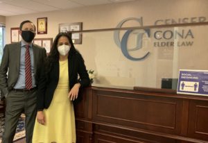 Two Cona Elder Law attorneys wearing masks