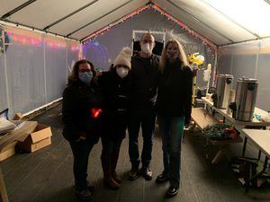 Four people from the Cona Elder Law team serving hot cocoa