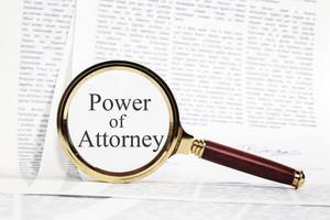 Power of attorney document with a magnify glass