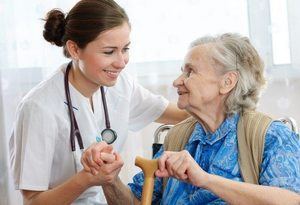 A doctor with her elderly patient