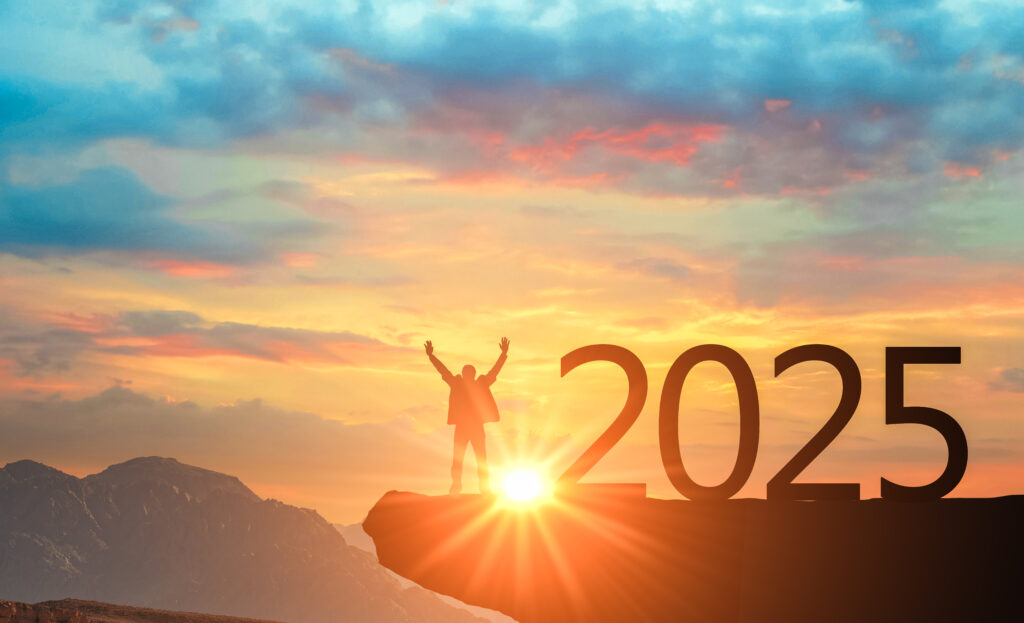 2025 and Silhouette man in mountains against backdrop of bright colorful sunset. Silhouette of number 2024 on mountain, concept Happy New Year celebration